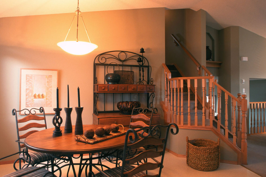 Wood stair detail with dark handrail