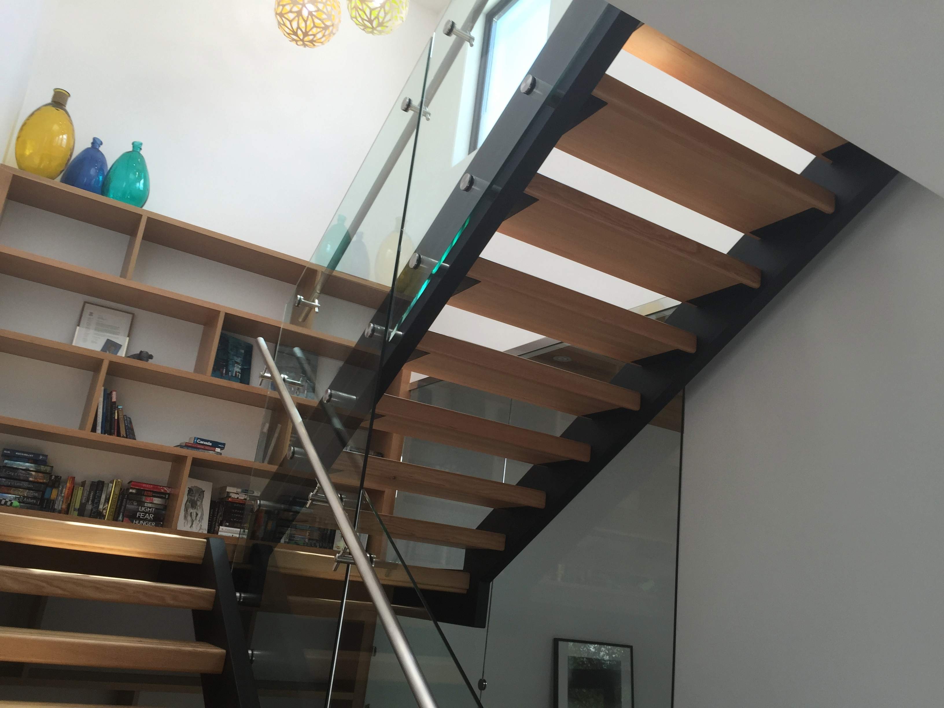 Straight wood staircase with white risers